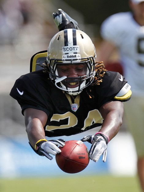 New Orleans Saints cornerback Laron Scott bats the ball during drills at NFL football training camp in Metairie, La., Wednesday, Aug. 1, 2012. (AP Photo/Gerald Herbert)