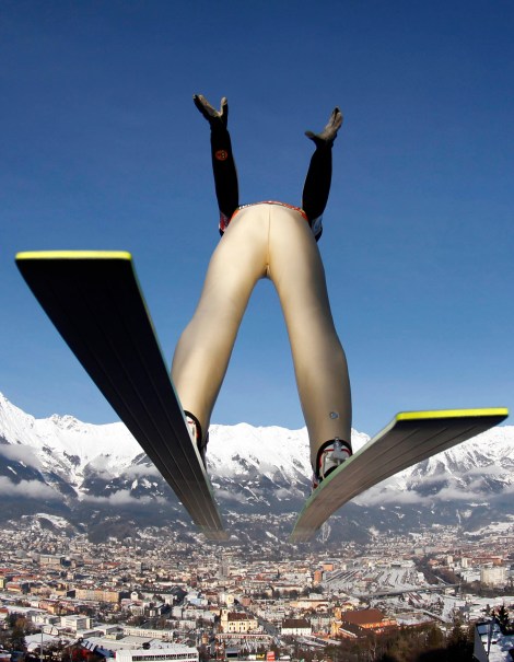 Bjoern Einar Romoeren of Norway soars during the third stage of the four hills ski jumping tournament in Innsbruck, Austria, on Tuesday, Jan. 3, 2012. (AP Photo/Matthias Schrader)