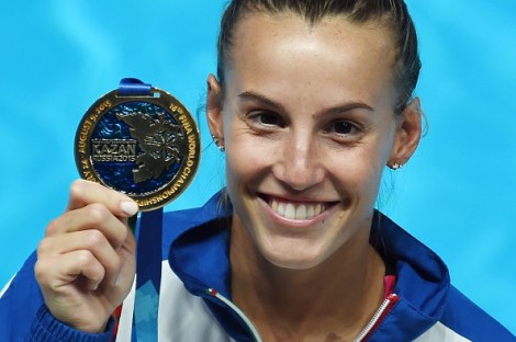 Italian diver Tania Cagnotto poses with her gold medal during the podium ceremony of the Women's 1m Springboard final diving event at the 2015 FINA World Championships in Kazan on July 28, 2015.  AFP PHOTO / CHRISTOPHE SIMON        (Photo credit should read CHRISTOPHE SIMON/AFP/Getty Images)